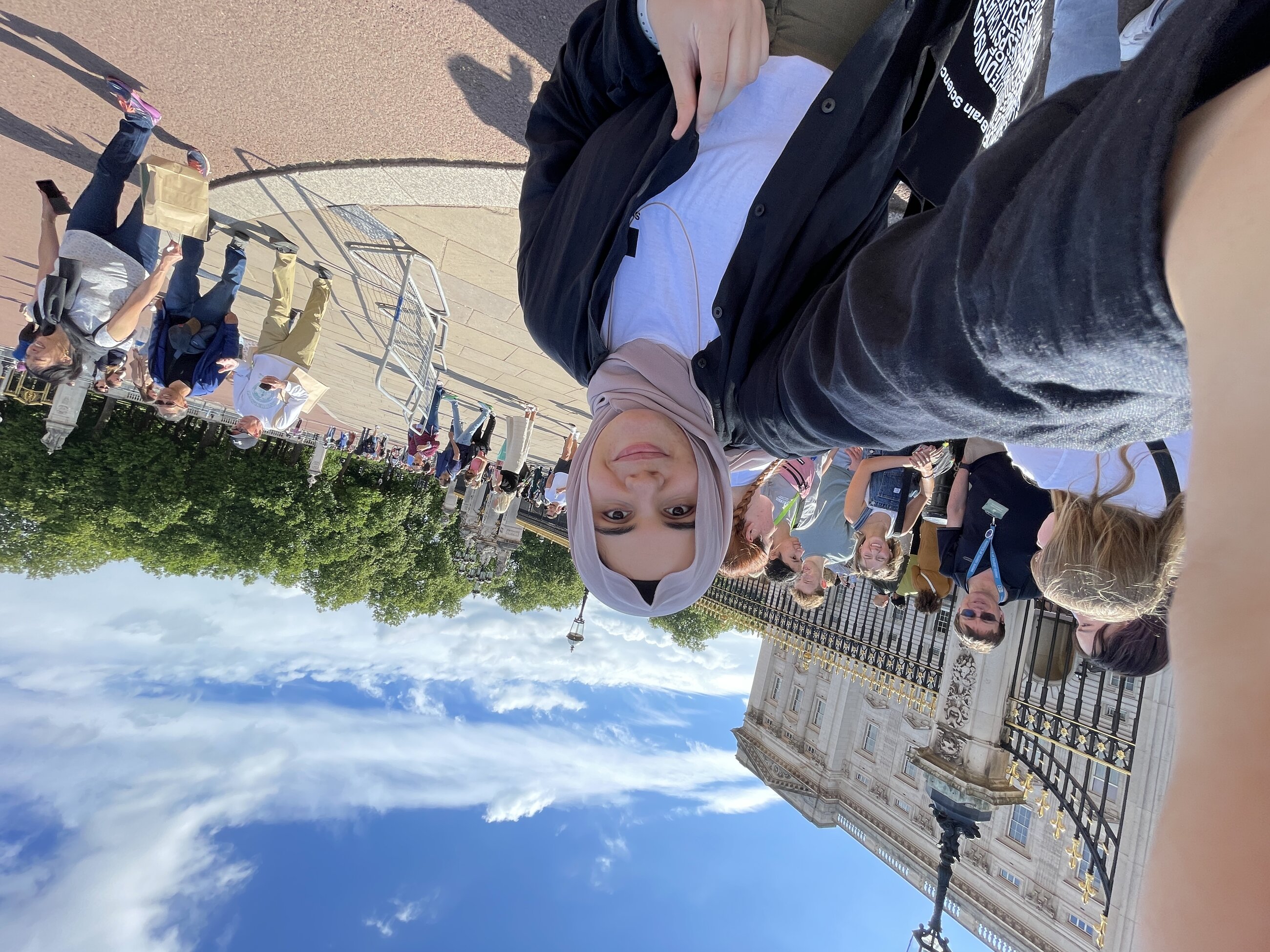 A selfie of me next to Bukingham Palace in London.