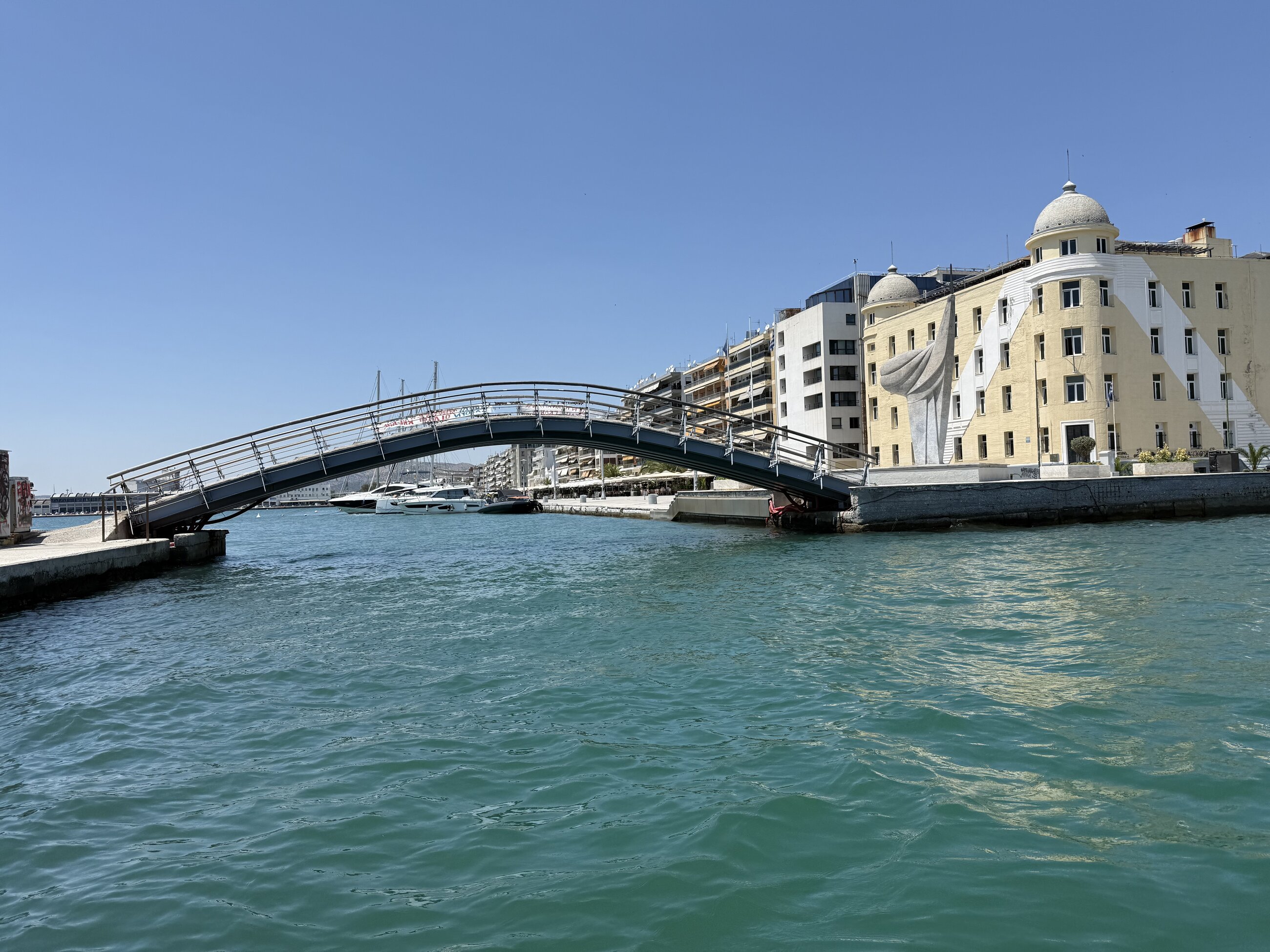 The yellow building is the university which is located directly on the port.