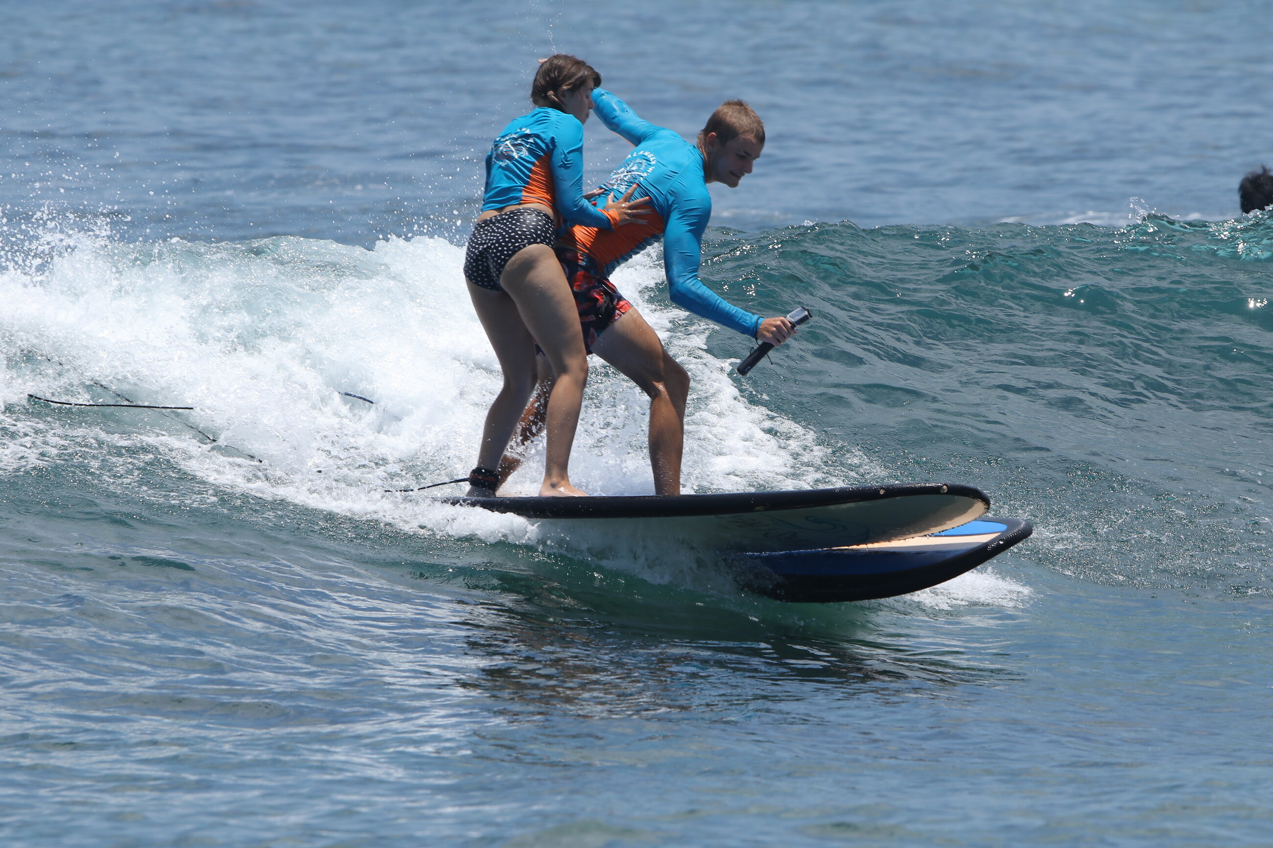 Pushing Spencer off of his surf board