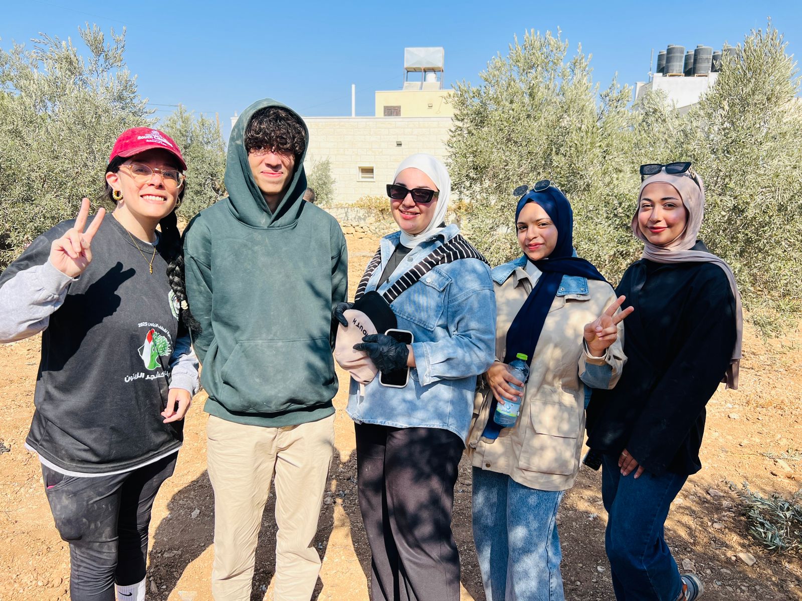 This was when the group picked Olives on a farm in Dura!