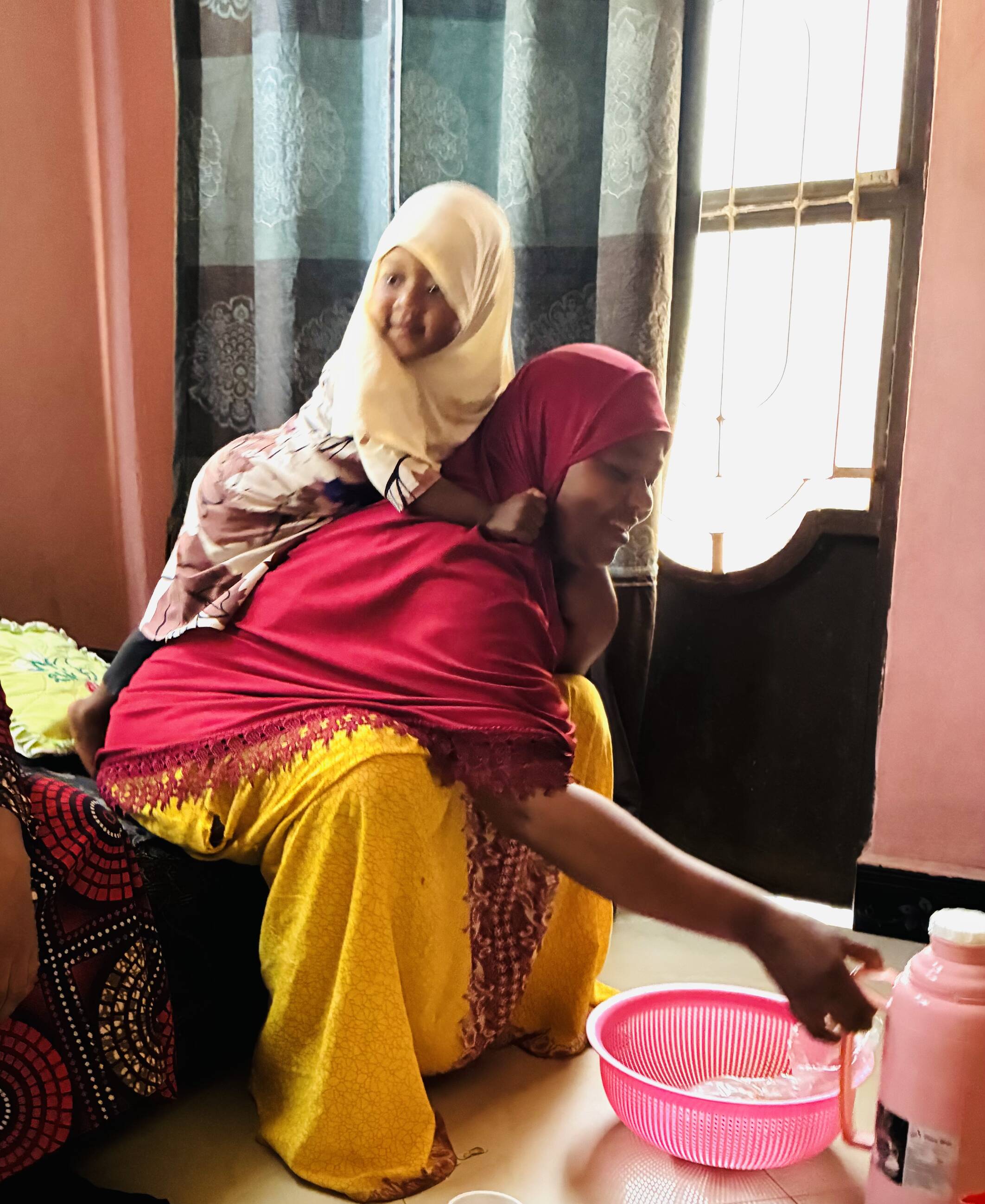 Biasina and daughter, home visit