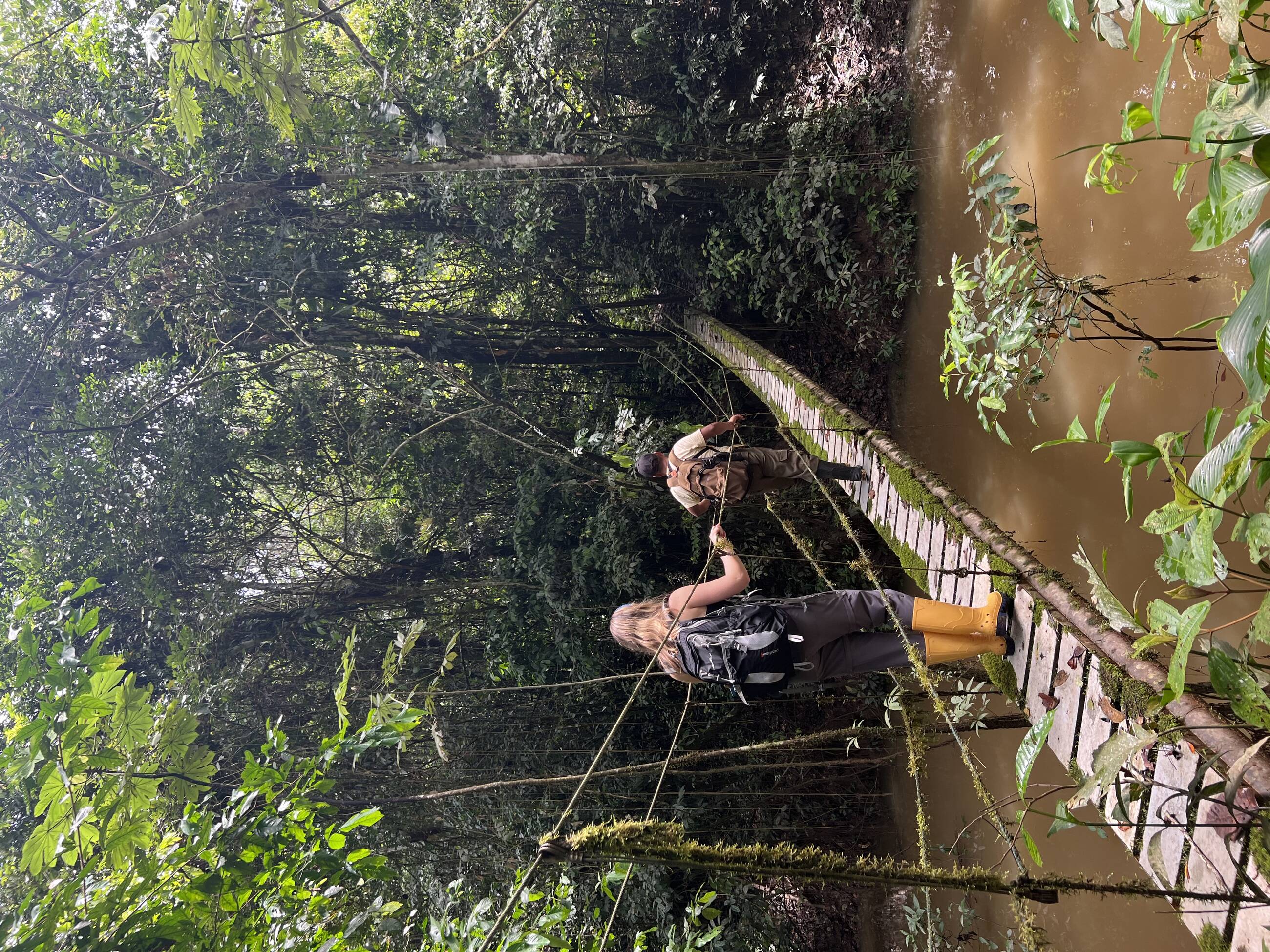Hiking on a trail at Tiputini Biodiversity Station in the Amazon with a guide