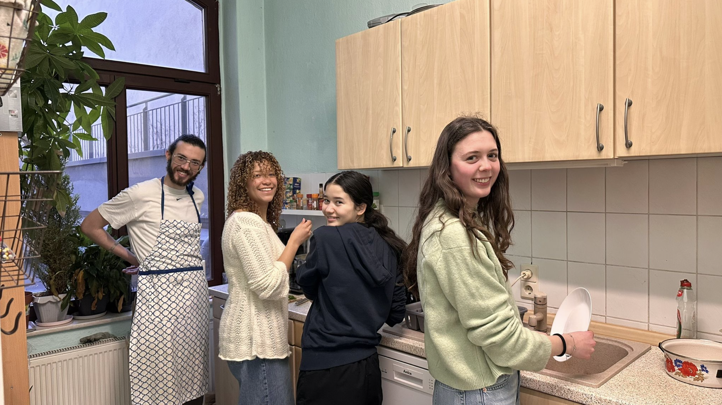 Volunteers and Excellence Center member preparing for meal