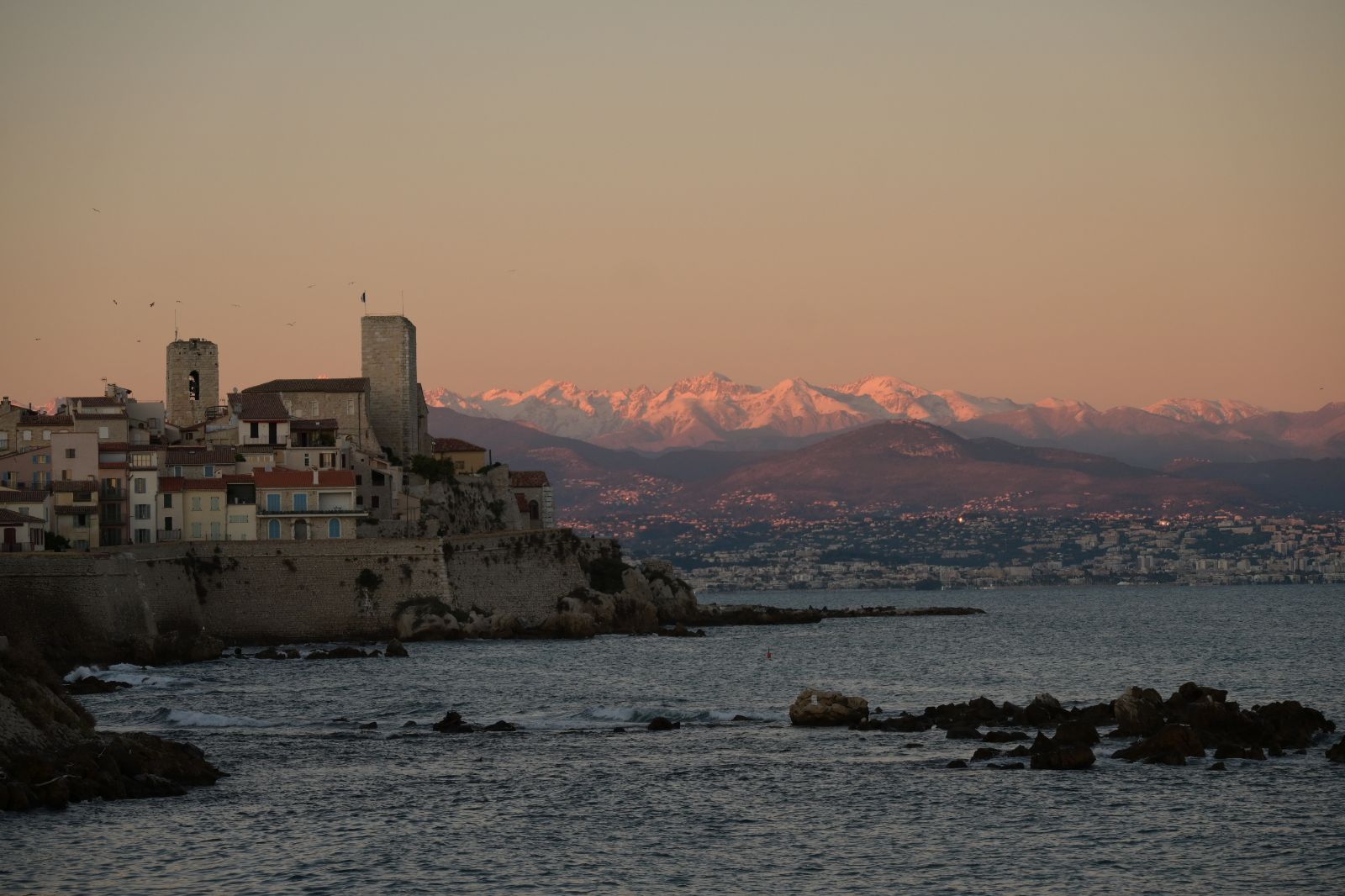 Snow caped alps from the beach in Antibes