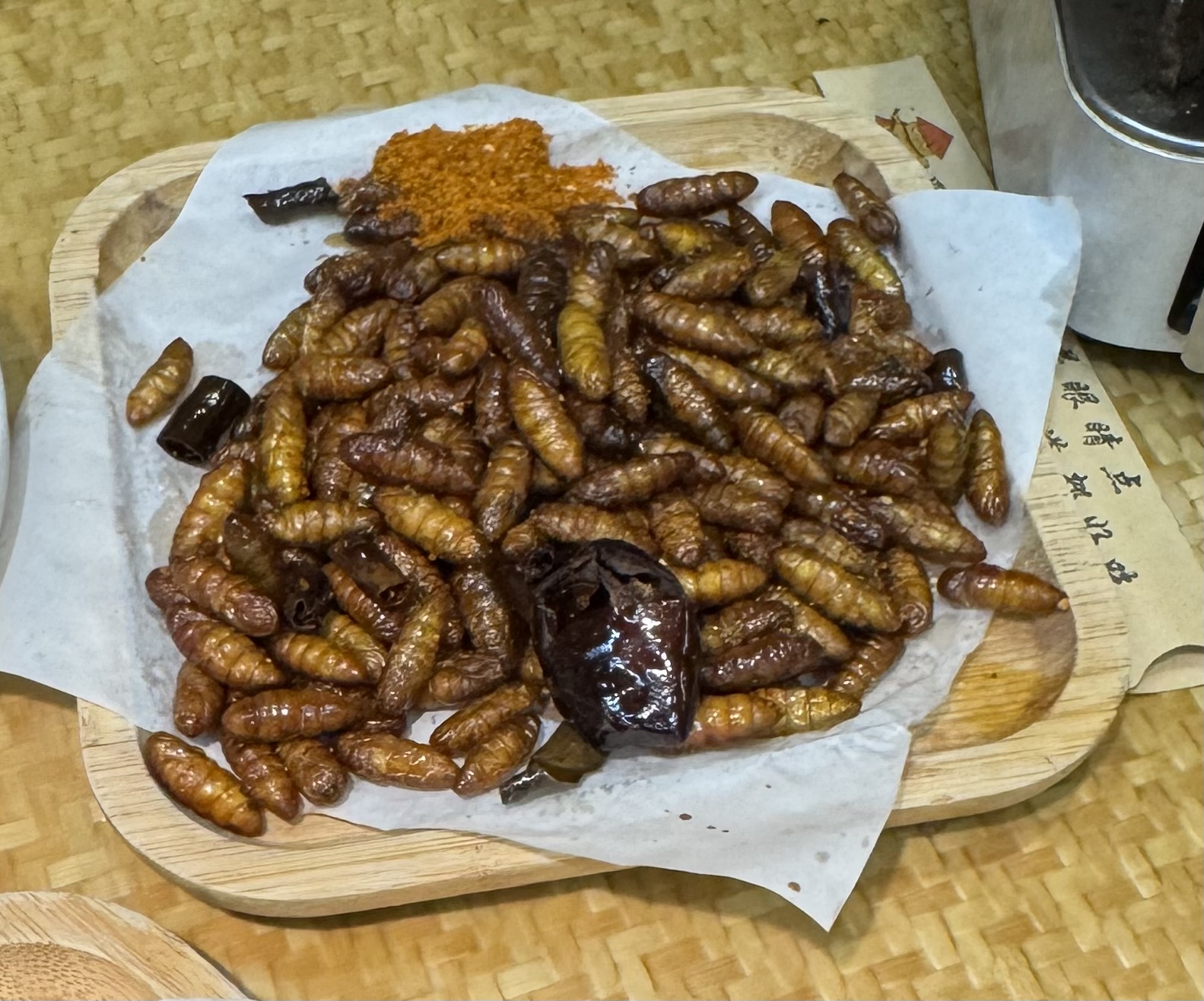 Silkworms with spicy sauce