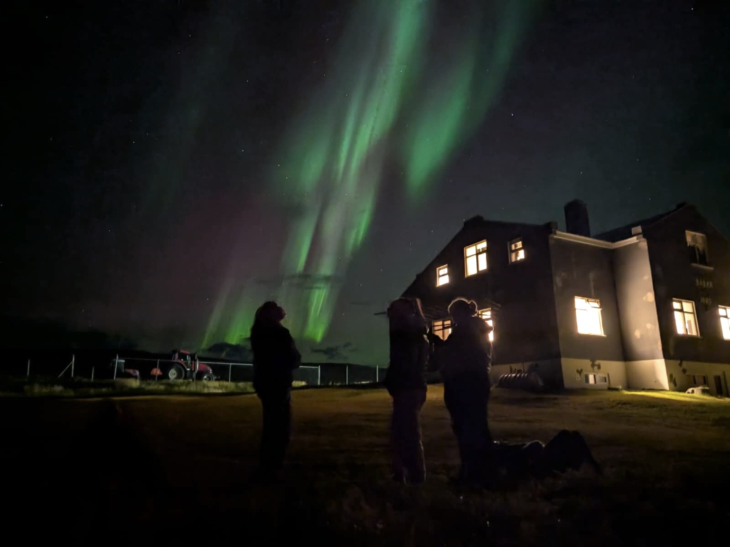 A few of us taking in the magical northern lights on Grímsey, an island off the north coast of Iceland