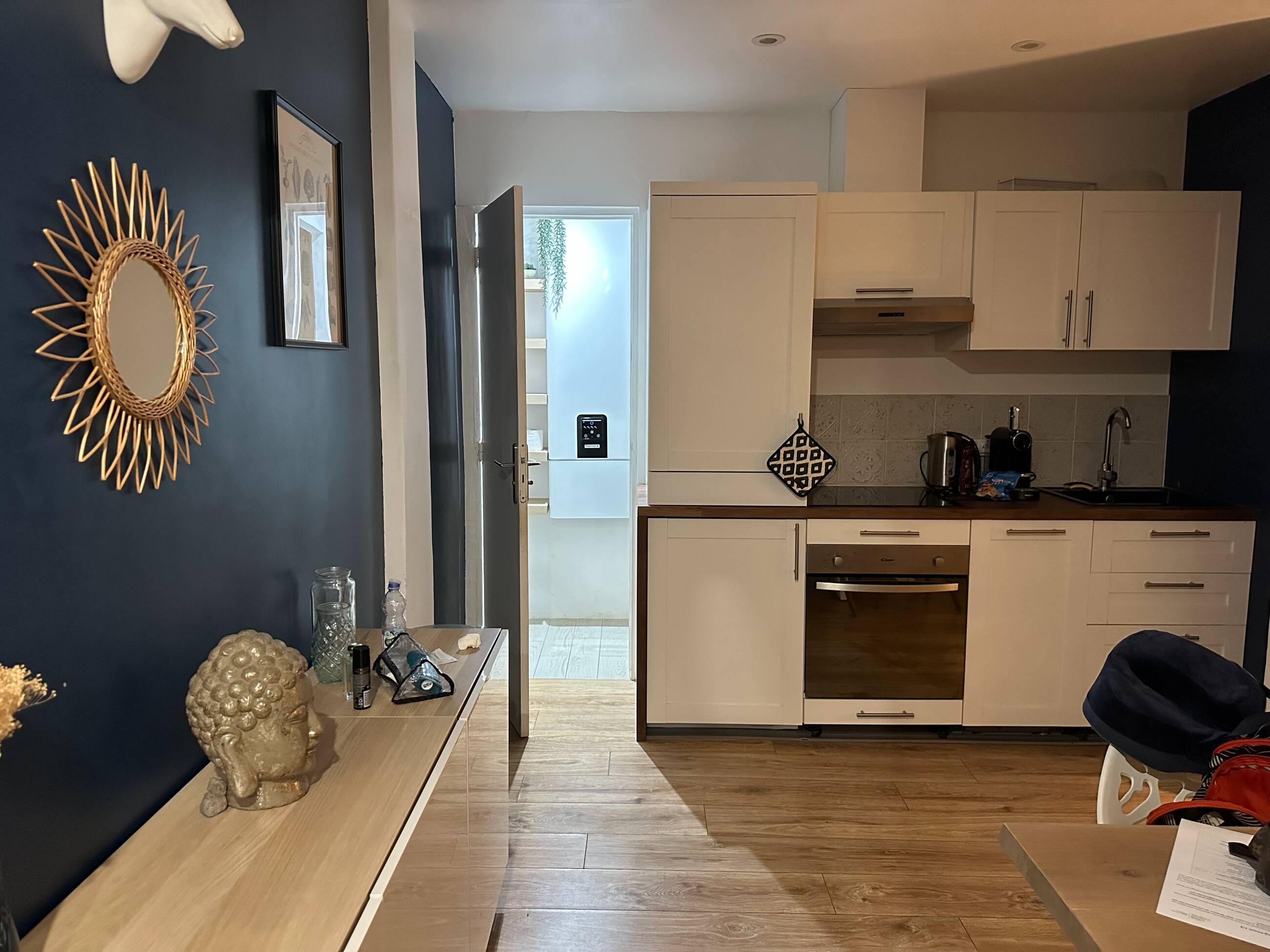 Apartment kitchen and bathroom entrance.