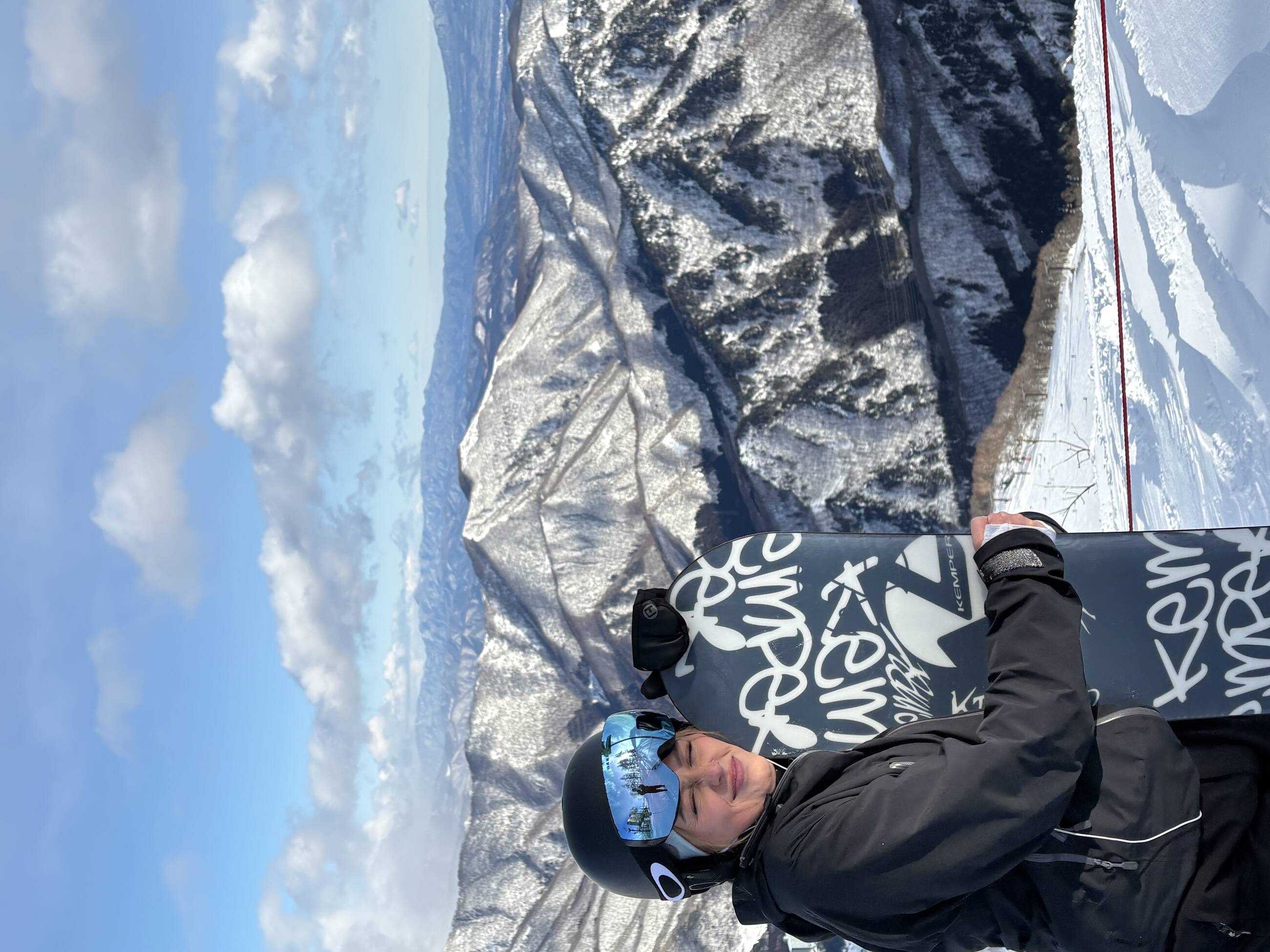 Me with my snowboard with the mountain view