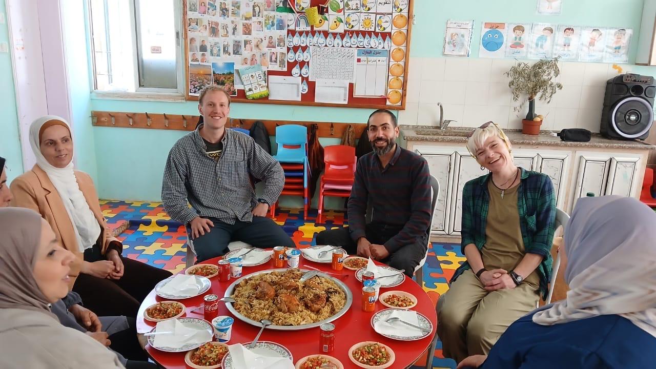 Enjoying delicious traditional Palestinian dish (maklouba) made for us at Al Arub Camp