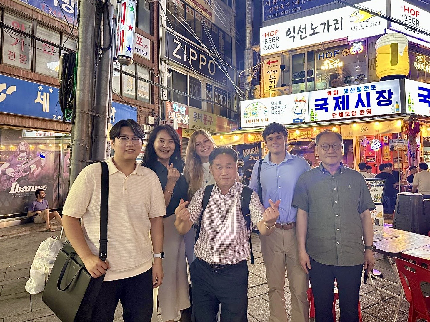Interns, CEO, and financial partners after a company dinner