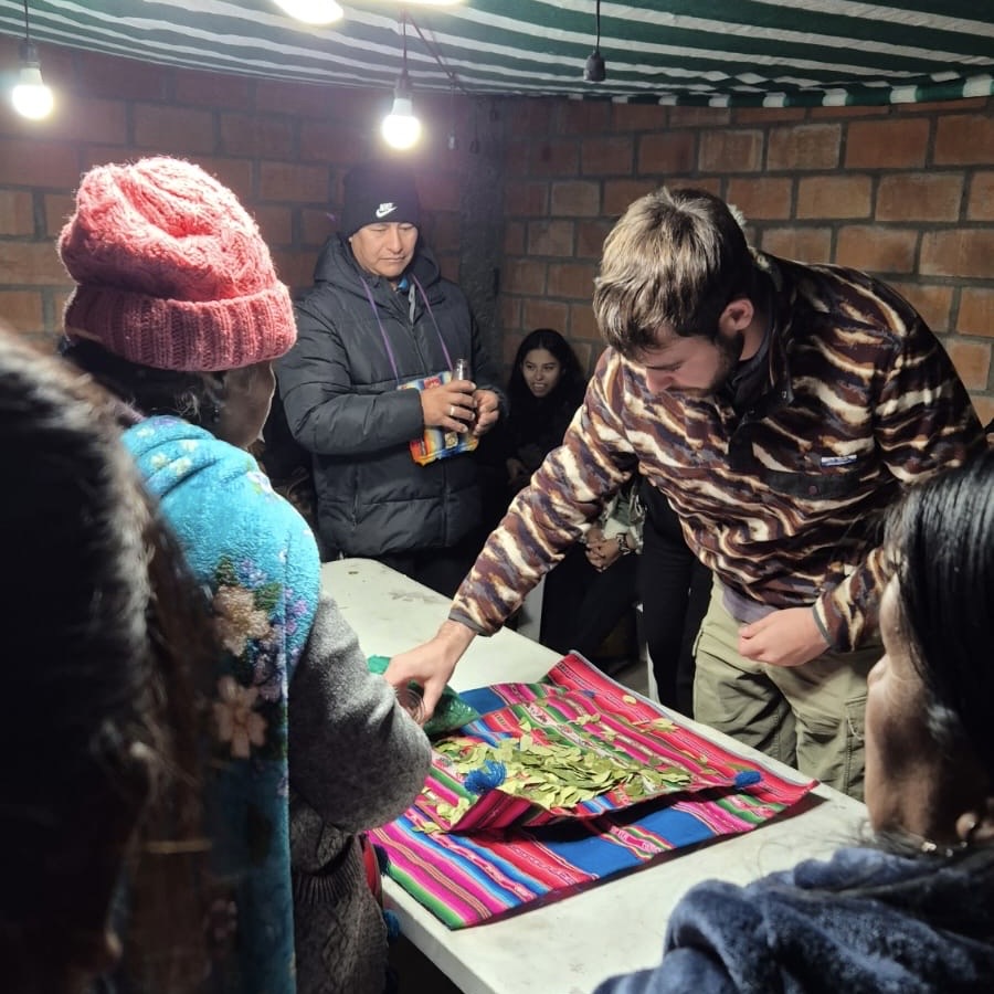 Participating in Aymaran traditional ritual giving thanks to Pachamama