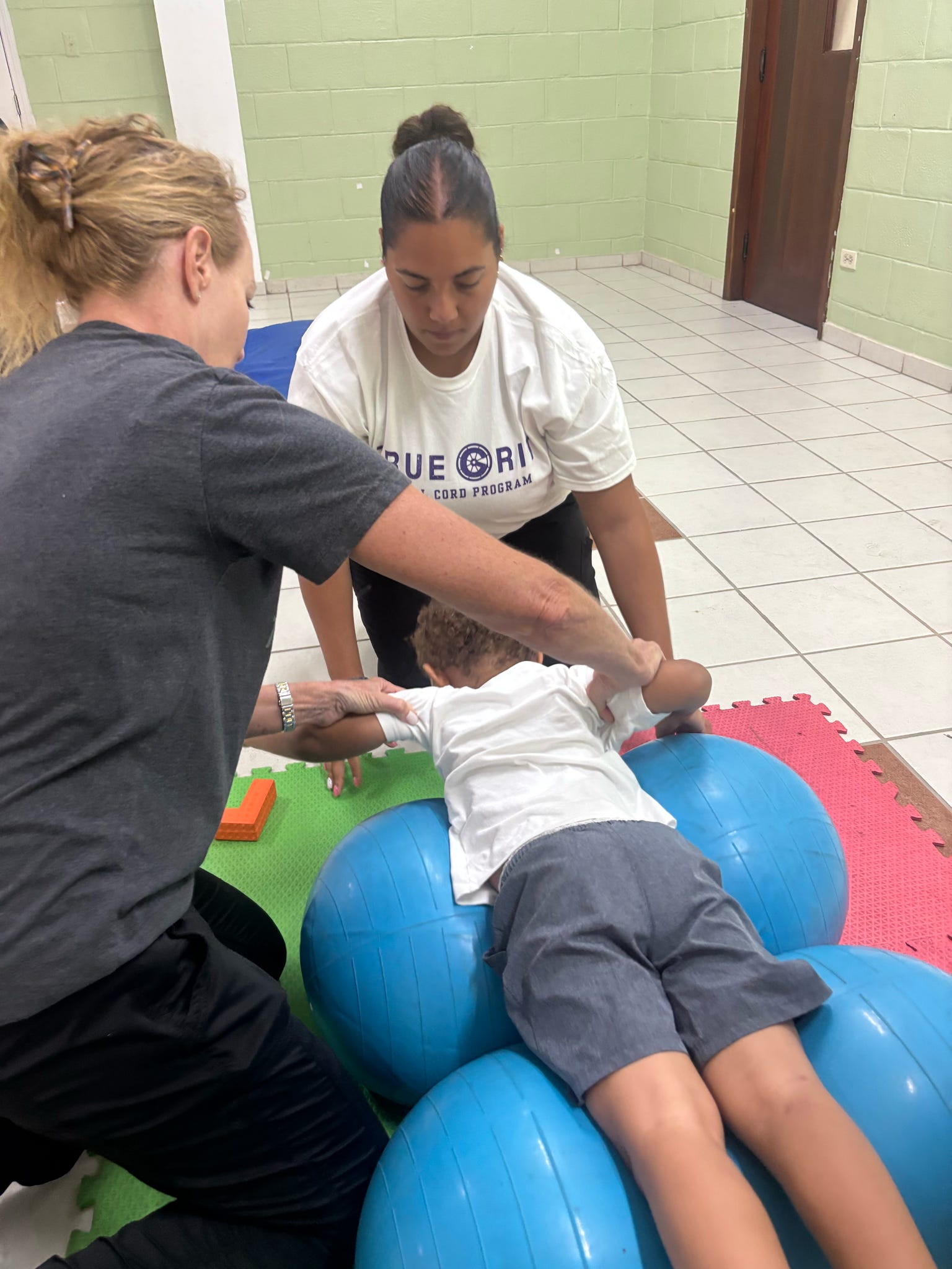 Working on head/neck extension/elevation while activating core muscles for stability and postural control. to build trunk support