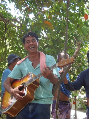 Man in the Philippines playing guitar