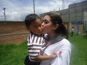 Girl kissing boy in Guatemala