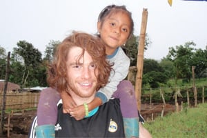 Volunteer playing with kids in Ecuador