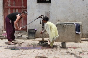 child at water fountain