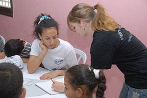 Faith teaching refugee teenagers English in Palestine