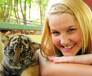 Jennie getting up close with tiger cubs in Thailand