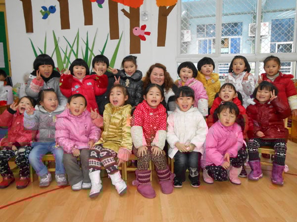 A group photo of Samantha and her students