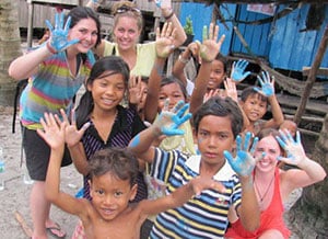 Volunteers painting in Asia 