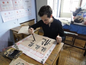 Hutong School students learn calligraphy