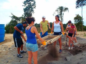 My group and I hard at work sifting cement