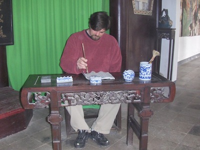 Kohler practices writing Chinese characters.