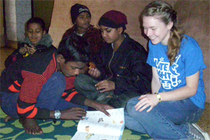 A volunteer working with Indian kids