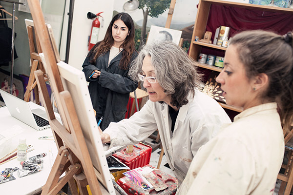 CAPA Florence students learning from an art teacher at the art studio