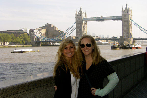 Marisa with a friend in front of London's Tower Bridge