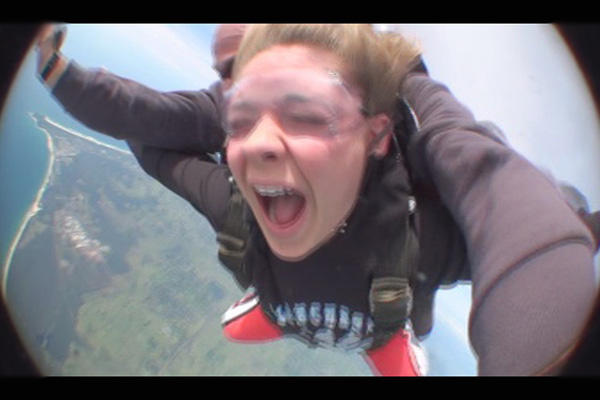 An awesome shot of Erin skydiving down under!