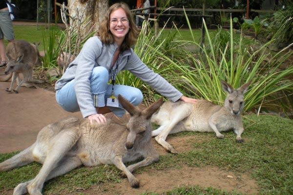 Cecilia petting some kangaroos in Australia