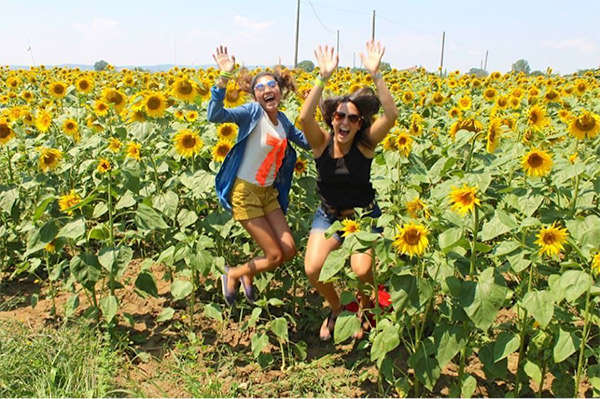 Heather and fellow GE intern Fabiola frolicking through a sunflower field!