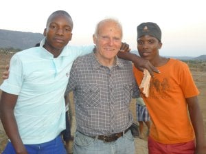 Heiko with two seniors hanging out at a local youth program.