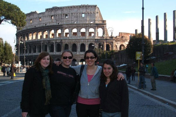 Natalie and friends in front of the coliseum