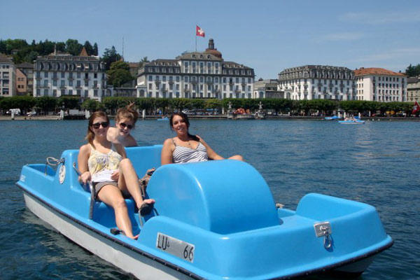 Emma with some friends paddle-boating in Switzerland