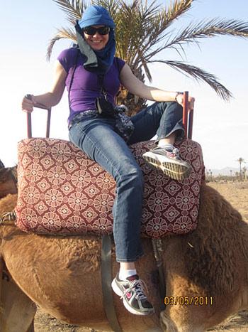 Mary riding a camel in Morocco!