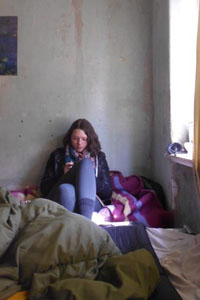 VFP Volunteer sitting on bed