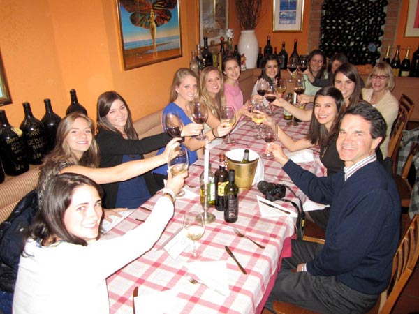 Mary-Alice enjoying a glass of wine with some friends