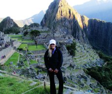 Emily atop Machu Picchu as the sun rises
