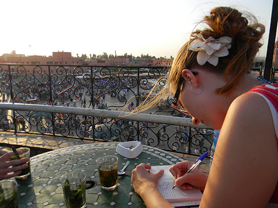 Gwyneth writes in her journal during her study abroad in Morocco.