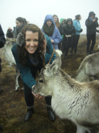 girl with reindeer in scottish highlands