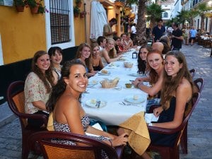 students enjoying a meal in Spain
