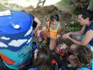 Isabelle, the designated group artist, and a trashcan she painted on the las