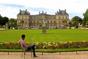 Meditating in a beautiful Parisian garden. Luxembourg Gardens in Paris, France. Luxembourg Gardens