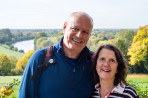 husband and wife smiling