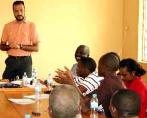 man teaching a group of adults