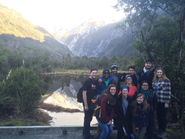 group by a lake in new zealand