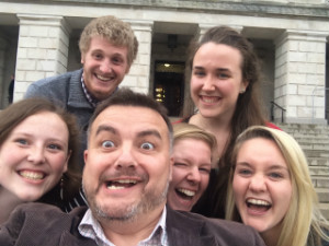 "Celebrating with students valuable encounters at Northern Ireland’s Government. Stormont, Belfast." A group of people posing for a picture.