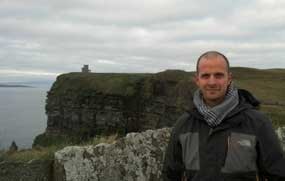 male hiking Burren and Cliffs of Moher Western Ireland